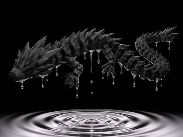 Long 3D printed articulated dragon with segmented body, ridged spines and moveable joints