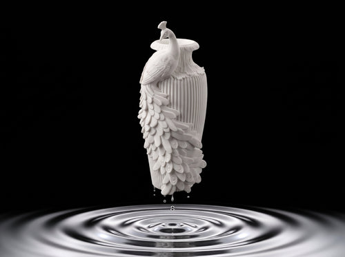 3D printed bird-shaped vase holding dried stems