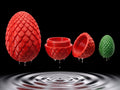Three nesting 3D printed dragon eggs with scaled texture, the outer shell opened to show a smaller egg inside